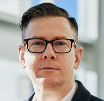 擔任加密貨幣交易公司執行長的 Alexander Hughes 個人照片